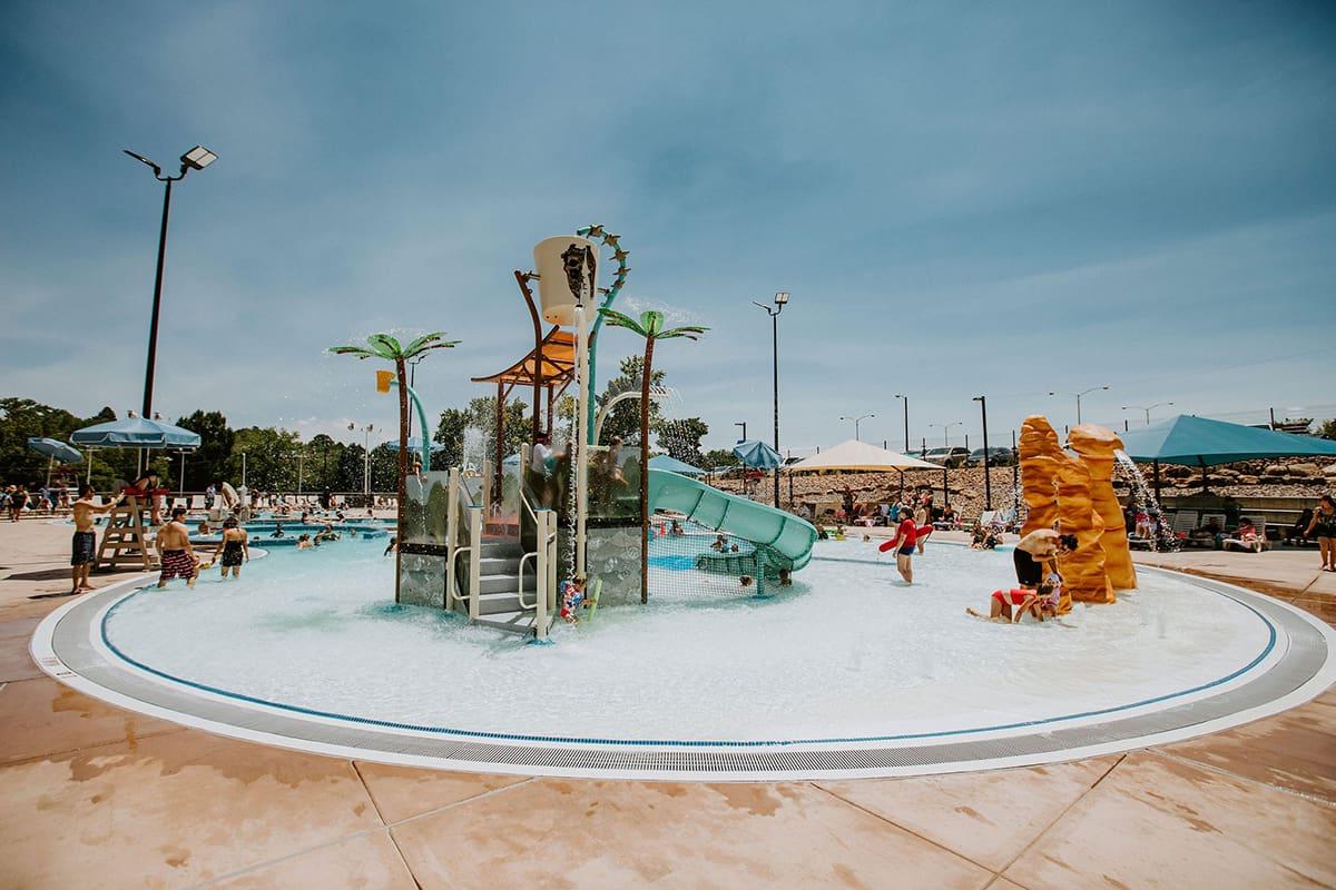 family splash around in the wading pools and waterfalls at Bisti Bay Waterpark in Farmington.
